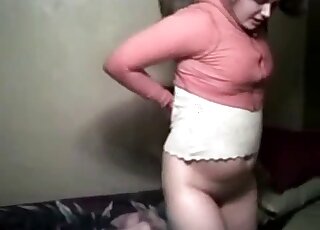 Massive booty brunette pulls up her skirt to let the dog fuck her