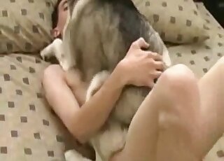 Dude pulls the animal by its legs while fucking it in missionary