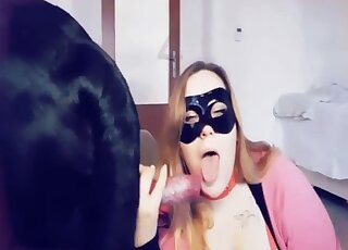 Redhead throats the dog's dick until sperm begins flooding her lips
