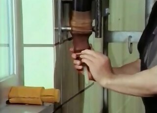 Dominant farmer in dark clothes gives a nice handjob to a horse